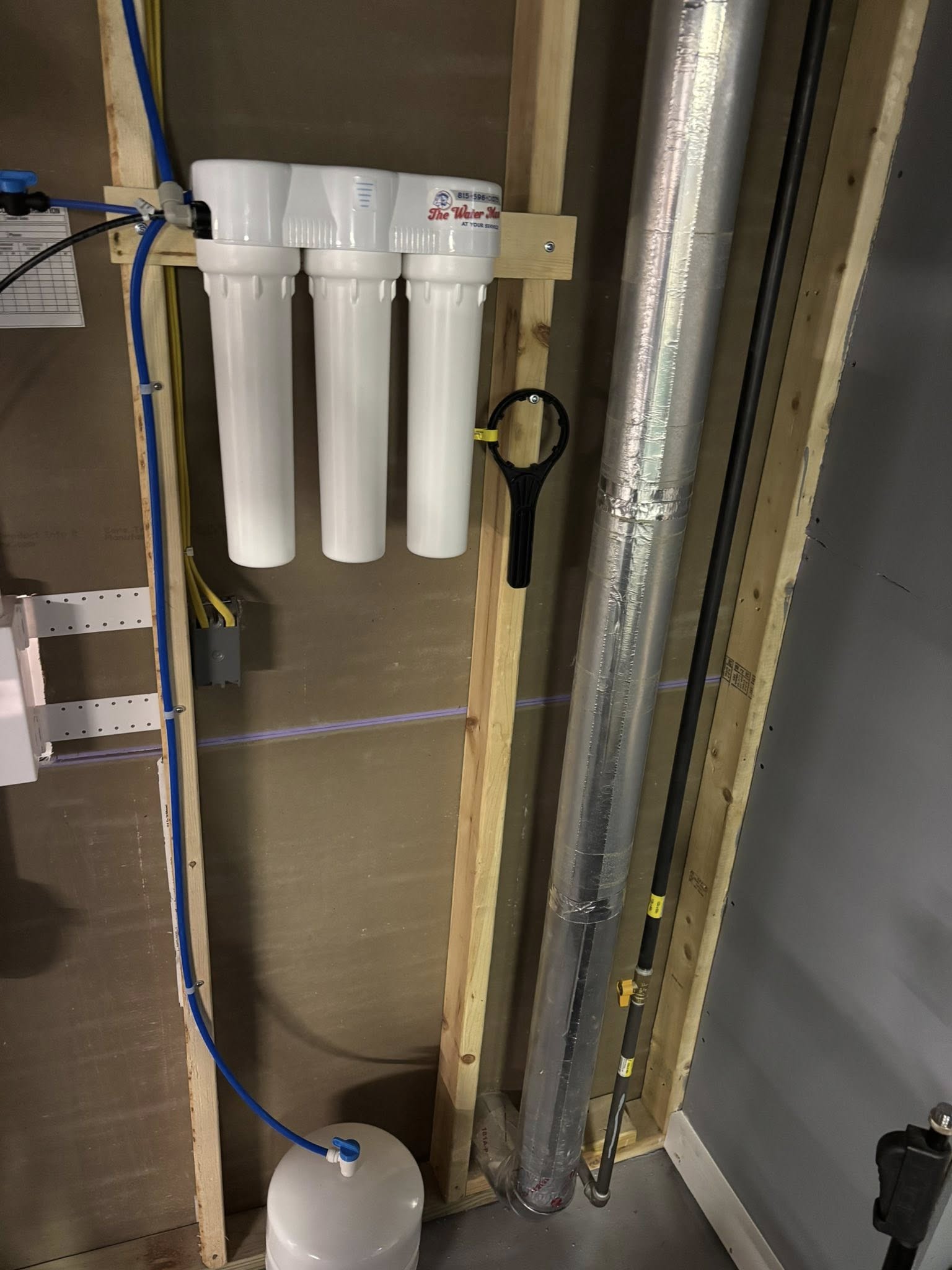 Under-sink reverse osmosis system installed by The Water Man